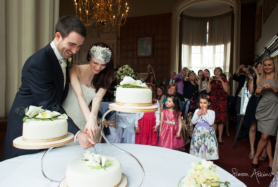 cutting the cake at a northamptonshire wedding