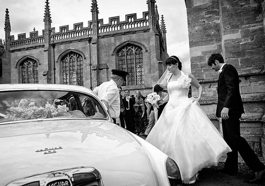 wedding couple outside St Mary's church in Higham Ferrers