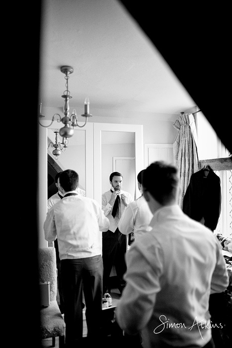 rushton hall wedding photos showing the groom getting ready