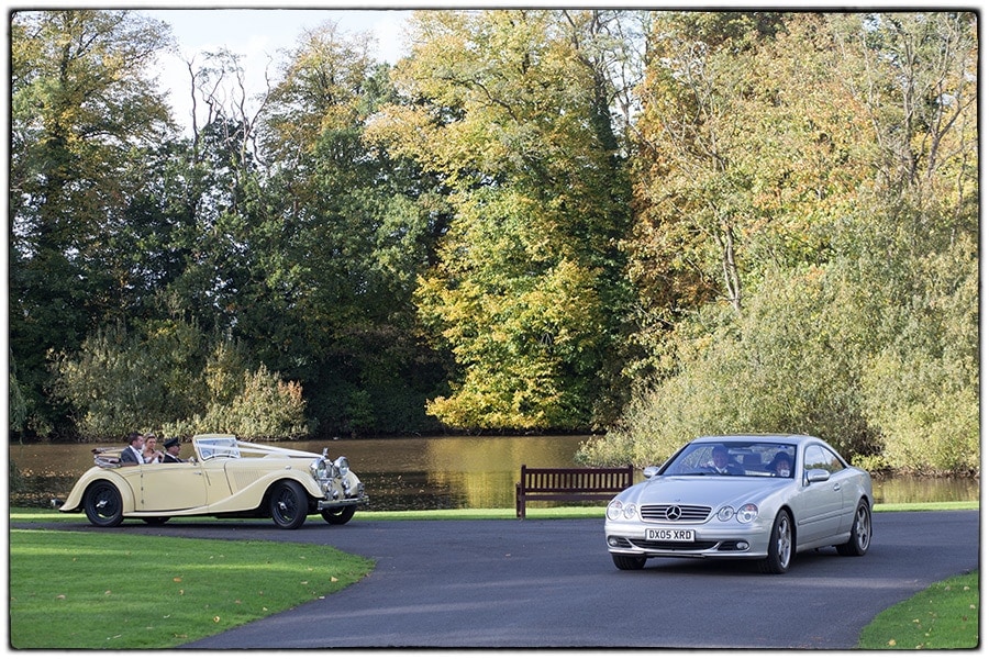 Brokencote Hall wedding photography, the bride and groom waving to guests