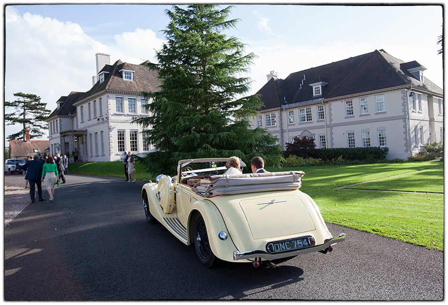 Brokencote Hall wedding photography the bride and groom arriving at the venue