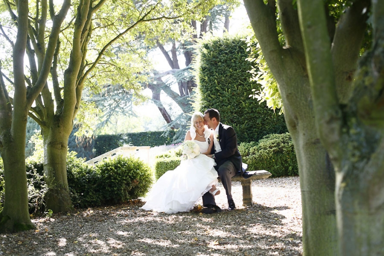Fawsley Hall wedding, the bride and groom in the gardens