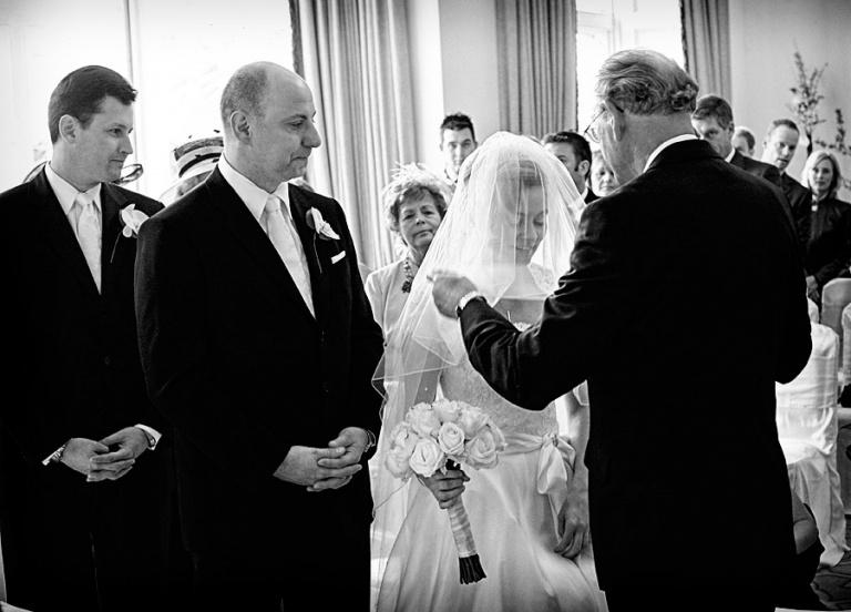 wedding ceremony at Fawsley Hall in Northamptonshire by wedding photographer Simon Atkins