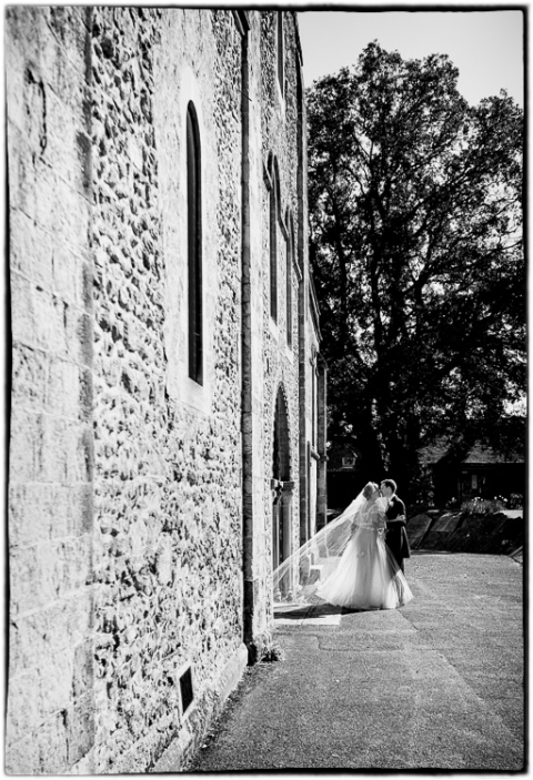 Tithe Barn wedding photography showing the bride and groom sharing a moment together after the wedding ceremony