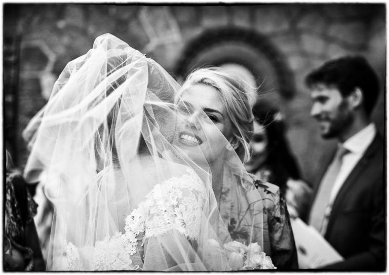 guests hug the bride at a Tithe Barn wedding