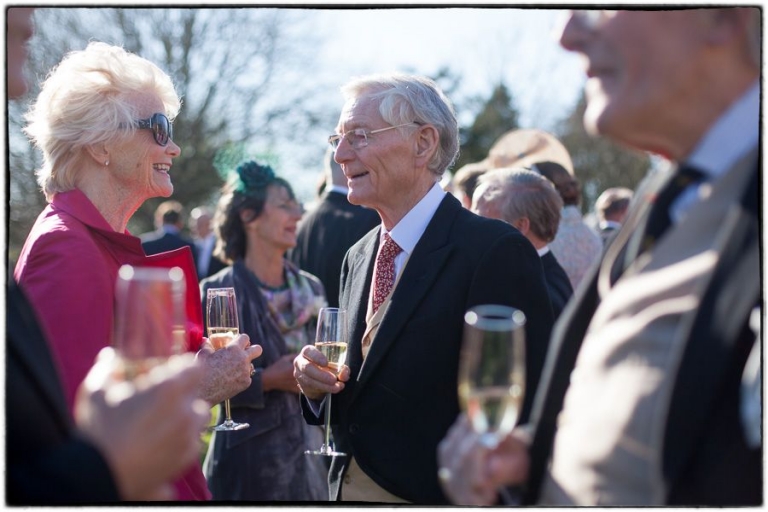 tithe barn wedding photographer, guests during the drinks reception