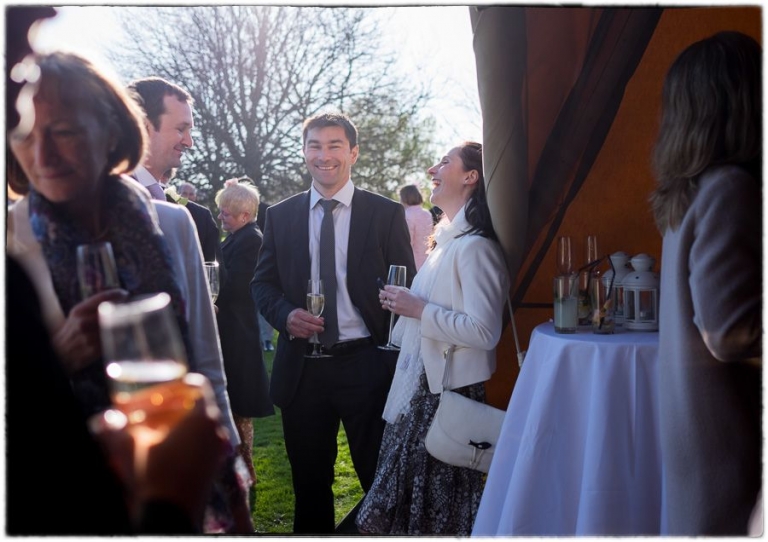 laughter at a Tithe barn wedding by Hampshire wedding photographer.