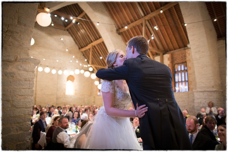 bride and groom kiss