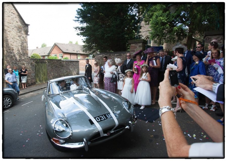 leaving in the e type jag, wedding.