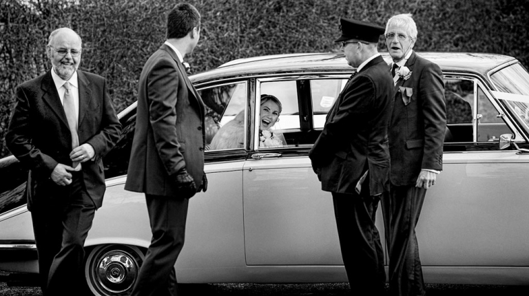 excited bride arriving for her wedding