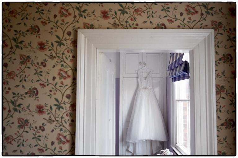 wedding dress hanging up