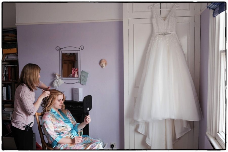 Laura getting ready at her parents house before her wedding at Norwood Park. 