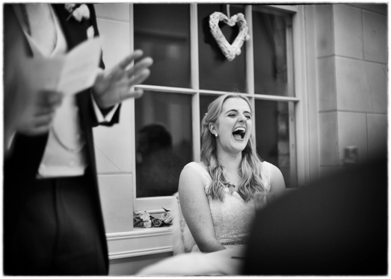 the bride laughs at the speeches