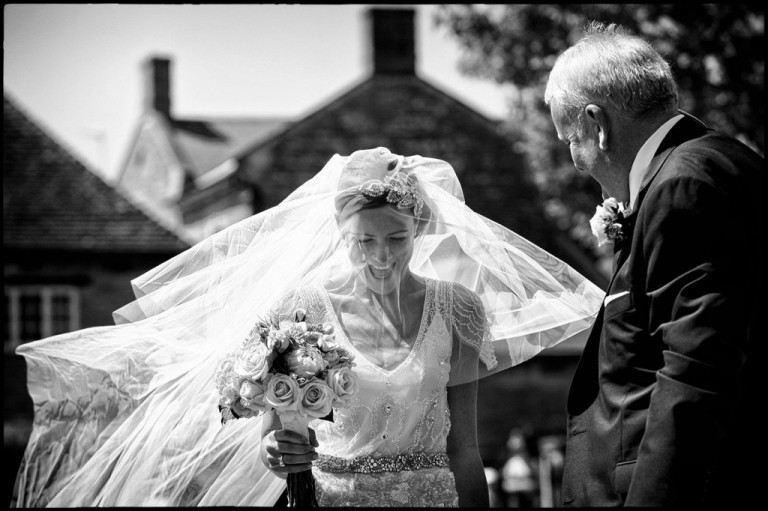 A storytelling moment showing the bride arriving for her wedding ceremony.