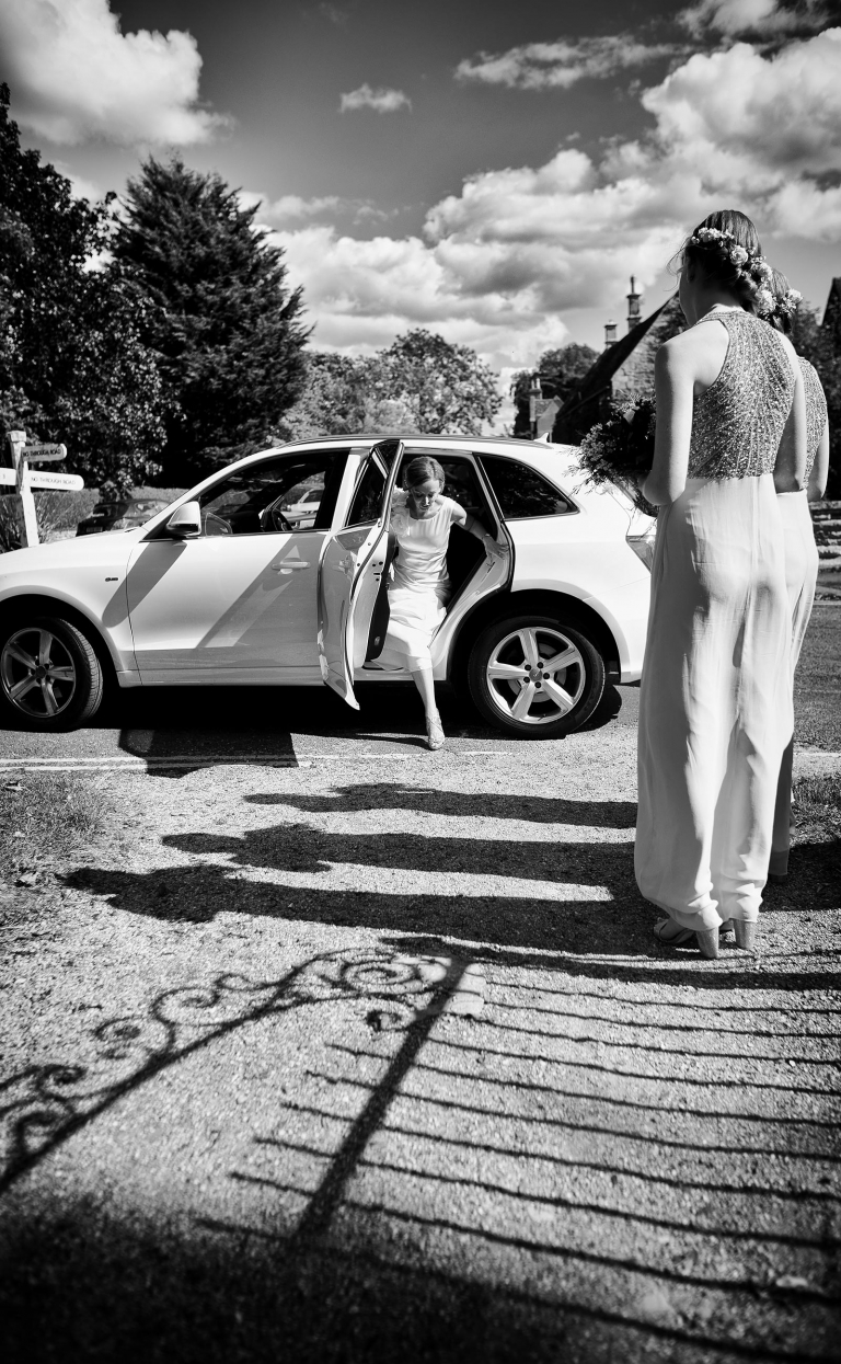 wedding photography at Hambleton in Rutland showing the bride arriving at the church