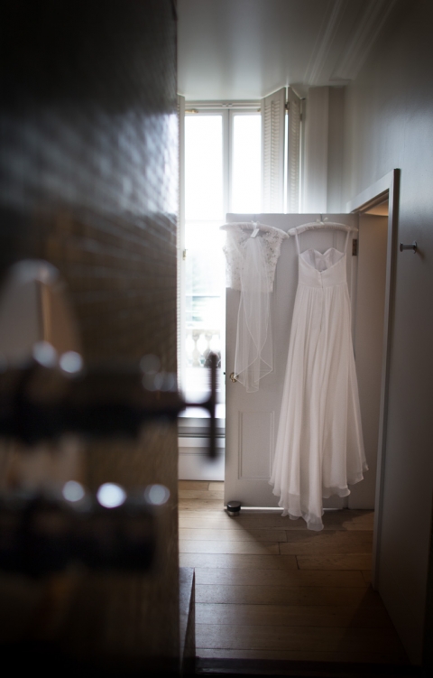 wedding dress hanging up at Cowley Manor