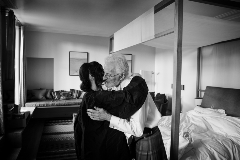 the bride hugs her father at Cowley Manor wedding