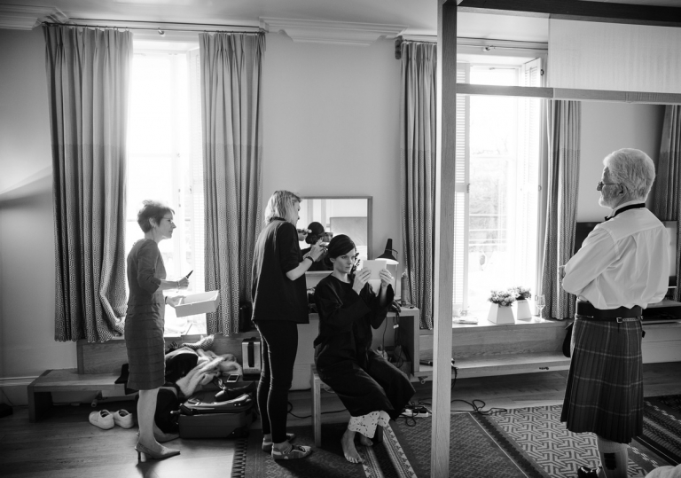 bride getting ready in the bridal suite at cowley manor