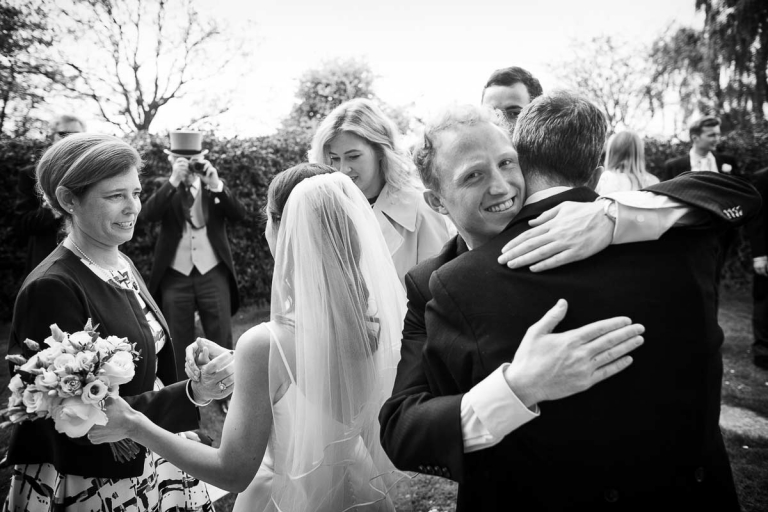 guests congratulate the bride and groom after the wedding ceremony at North Cadbury Court