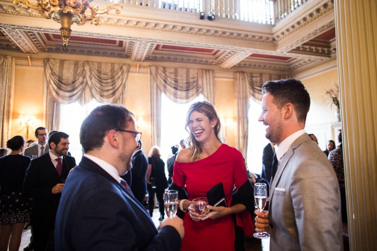 happy wedding guests at Hampton Court House