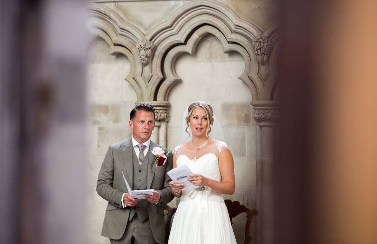 St Albans Cathedral wedding photographer, the bride and groom during the ceremony 