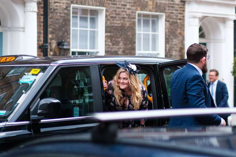 Guests arriving for a wedding at St Etheldreda's church 