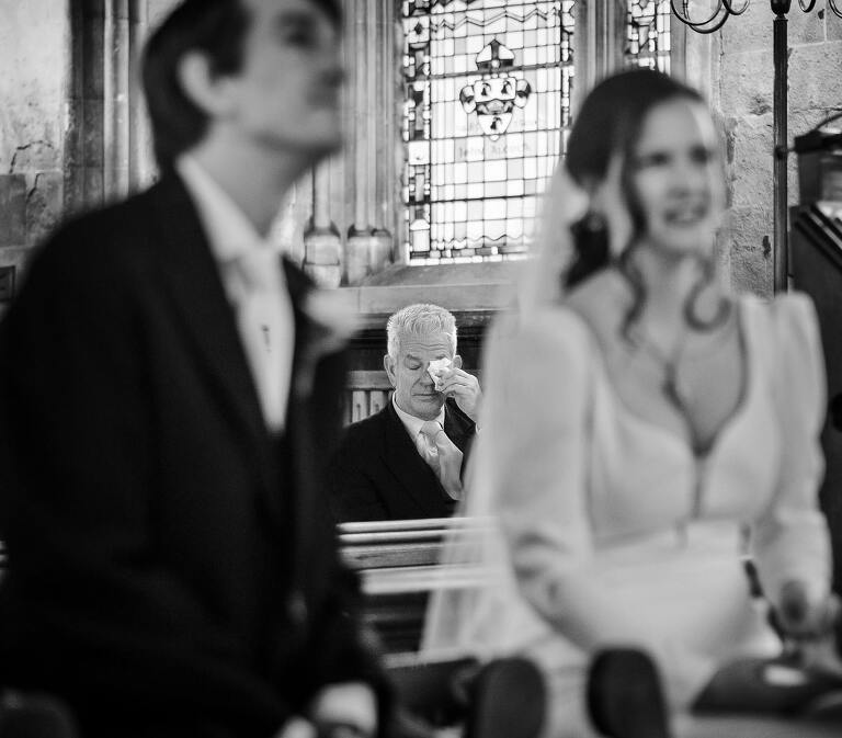Emotional father during a wedding at St Etheldreda's church 